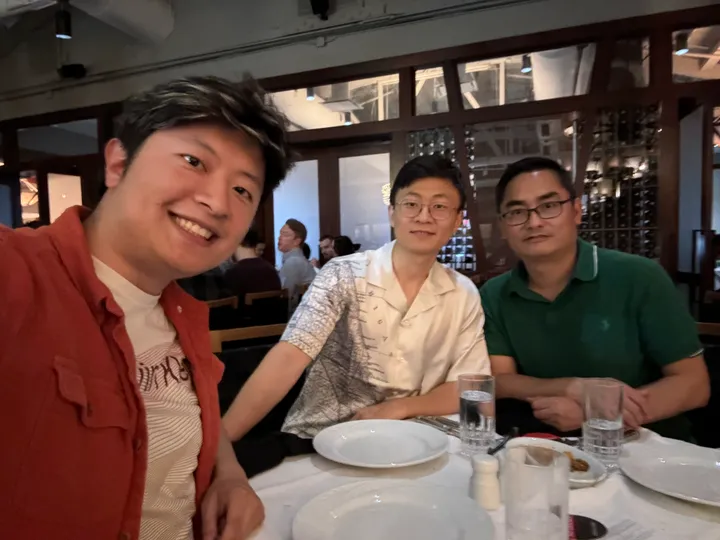 Jacky and two friends seated together at a restaurant
